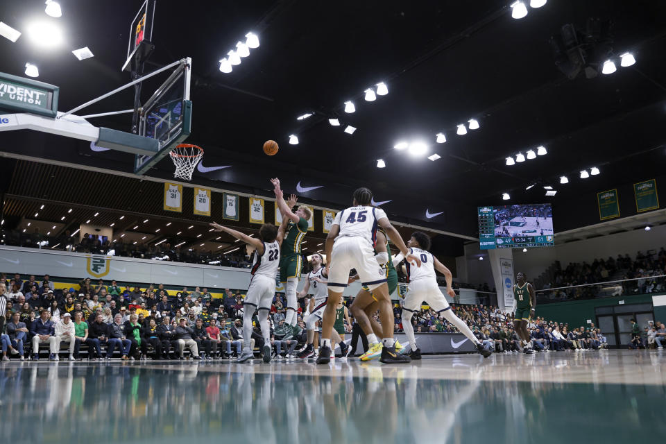 San Francisco forward Zane Meeks (15) shoots over Gonzaga forward Anton Watson (22) during the second half of an NCAA college basketball game in San Francisco, Thursday, Jan. 5, 2023. (AP Photo/Jed Jacobsohn)