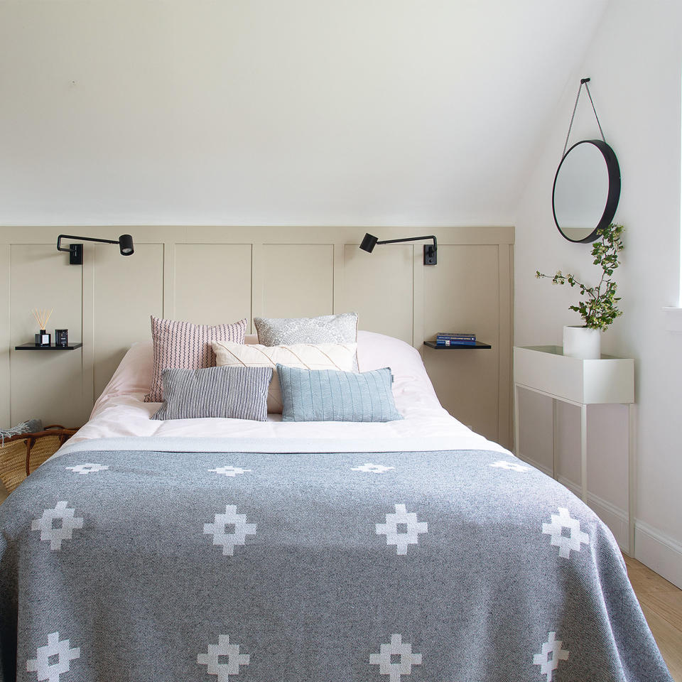 grey and white bedroom with panelling