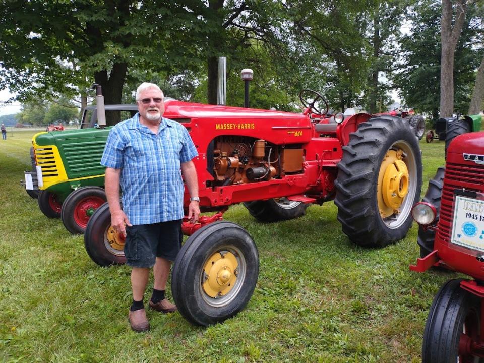 Gary Liedel of Dundee stands next to his tractor at the the 33rd Annual Southeast Michigan Tractor and Engine Show. Provided by Katie Tibai