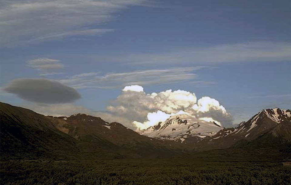 This web camera image provided by the U.S. Geological Survey shows a low-level ash plume from the Shishaldin Volcano captured on Tuesday, July 18, 2023. An ongoing eruption of a remote volcano in Alaska's Aleutian Islands produced an ash cloud so large Tuesday warnings were sent to pilots about potentially dangerous conditions.(Alaska Volcano Observatory/U.S. Geological Survey via AP)