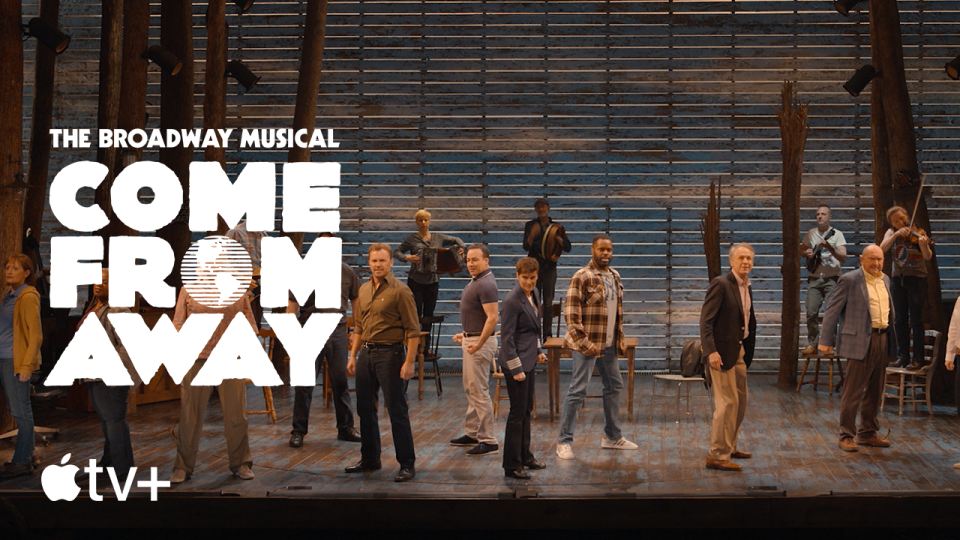 Cast of Come From Away performs on stage. Image via Apple TV+