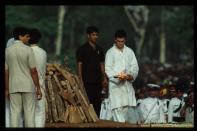 96646 08: Prime Minister Rajiv Gandhis son Rahul lights the fire to burn the pyre holding Gandhis body May 24, 1991 in New Delhi, India. Gandhi was assassinated in a suicide bombing by Tamils taking revenge for his intervention in the Sri Lankan civil war. (Photo by Robert Nickelsberg/Liaison)