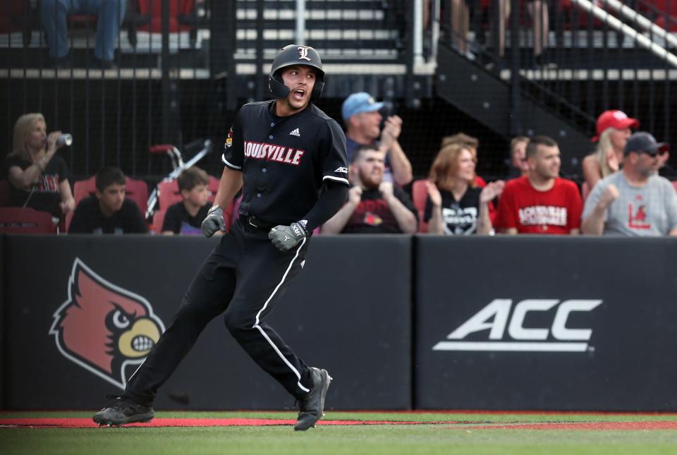 Louisville’s Christian Knapczyk scores a run against Wake Forest on April 14, 2023.