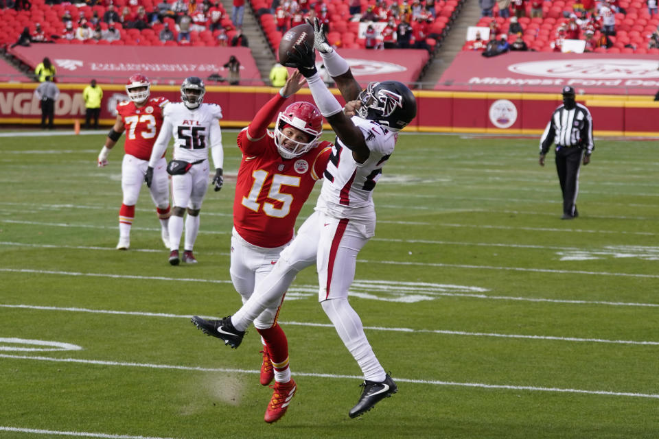 A pass intended for Kansas City Chiefs quarterback Patrick Mahomes is intercepted by Atlanta Falcons safety Keanu Neal during the first half an NFL football game, Sunday, Dec. 27, 2020, in Kansas City. (AP Photo/Jeff Roberson)