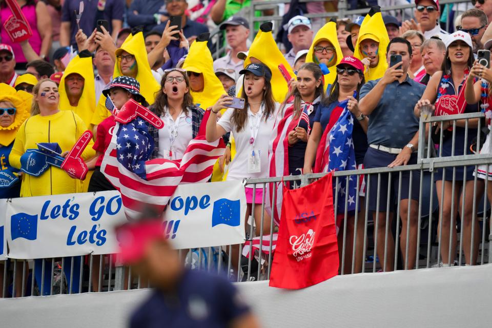 Fans cheer as Team USA hits from the first tee during Foursomes matches against Team Europe during the first round of the Solheim Cup 2024 at Robert Trent Jones Golf Club. Mandatory Credit: Aaron Doster-Imagn Images