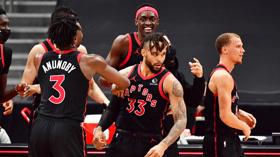 Gary Trent Jr. #33 of the Toronto Raptors celebrates with teammates after hitting a game-winning shot. (Photo by Julio Aguilar/Getty Images)