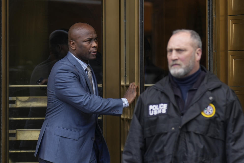 Sharrieff Shah, Jennifer Shah's husband, left, leaves federal court in New York, Friday, Jan. 6, 2023. A judge has sentenced Jennifer Shah, a member of "The Real Housewives of Salt Lake City", to 6 1/2 years in prison for helping to defraud thousands of people nationwide in a telemarketing scam. (AP Photo/Seth Wenig)