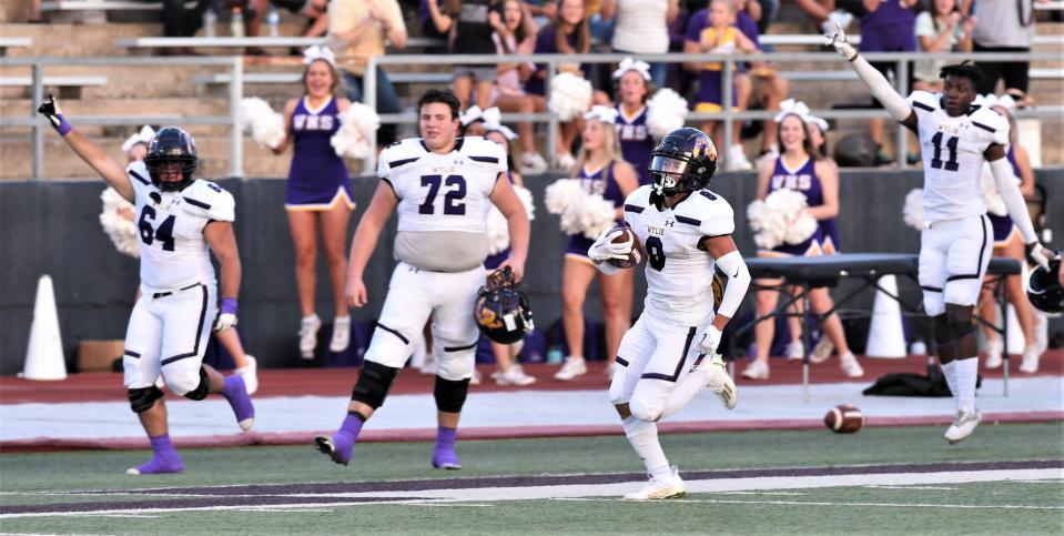 Wylie's Braden Regala, near right, runs for a 51-yard touchdown as his teammates react on the sideline. The score gave the Bulldogs a 16-3 lead over Brownwood with 2:20 left in the first quarter. The Bulldogs beat Brownwood 30-24 in the season opener last season at Gordon Wood Stadium in Brownwood.