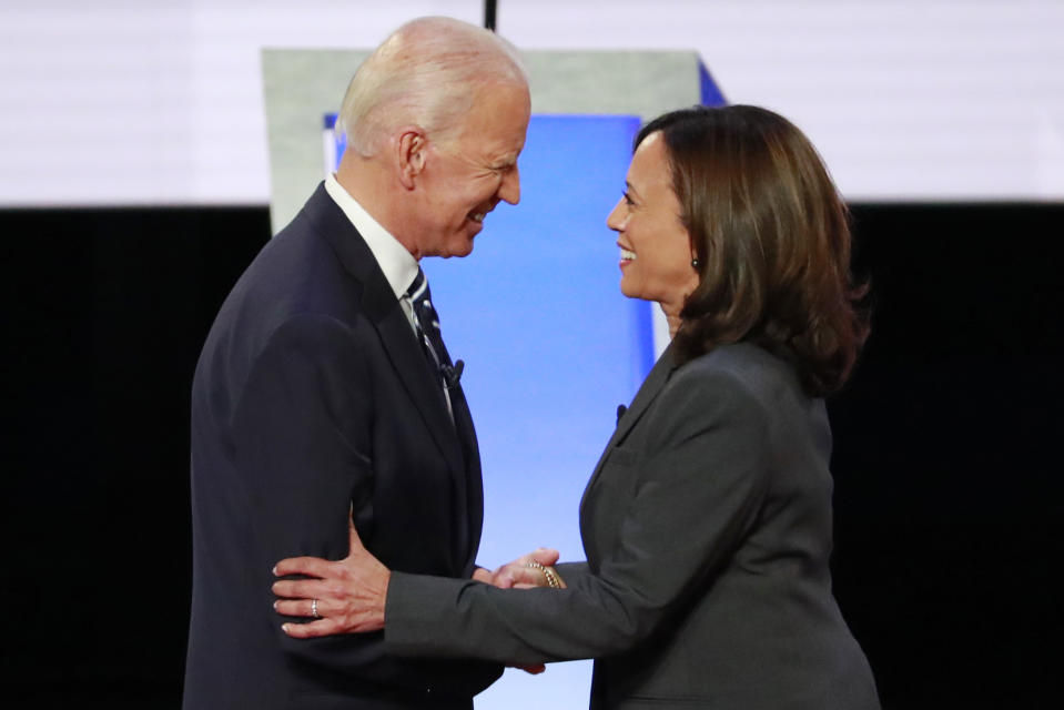 Former Vice President Joe Biden and Sen. Kamala Harris shake hands before the start of a Democratic debate in Detroit in July. (Lucas Jackson/Reuters)