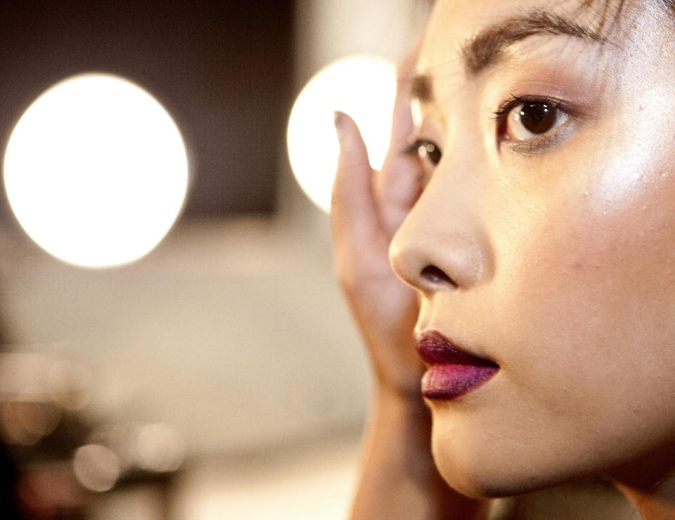 A model waits backstage for The Nicole Miller Spring 2014 collection show during Fashion Week, Friday, Sept. 6, 2013, in New York. (AP Photo/CX Matiash)