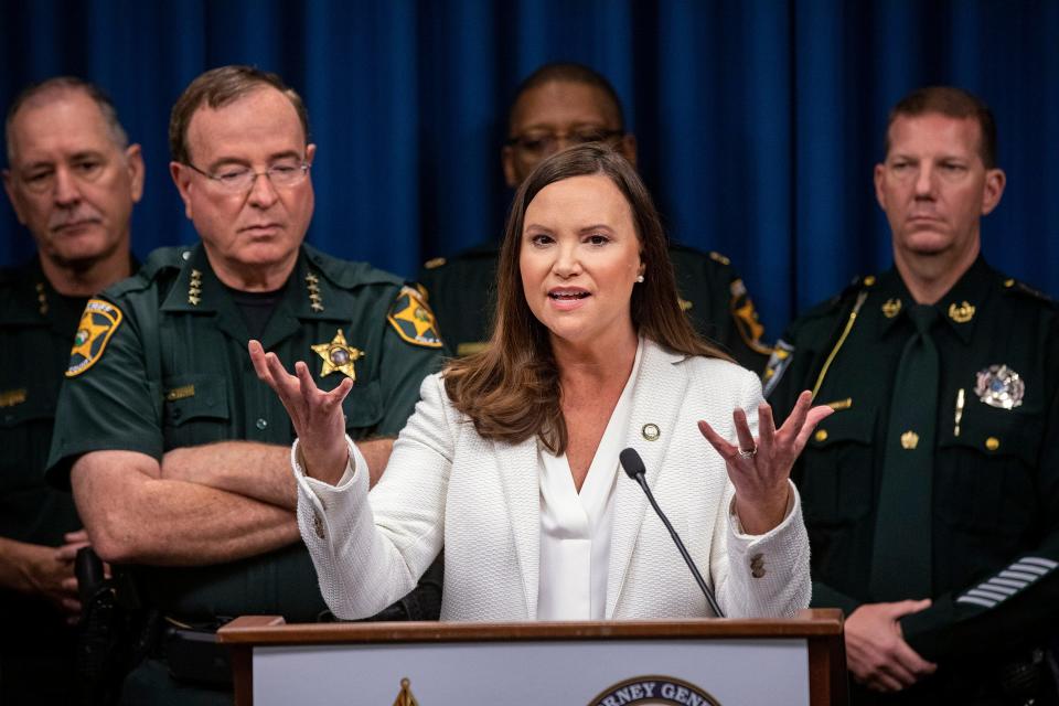 Florida Attorney General Ashley Moody, seen here at a Dec. 2, 2021 appearance in Winter Haven, speaking about the state’s opioid settlement case.