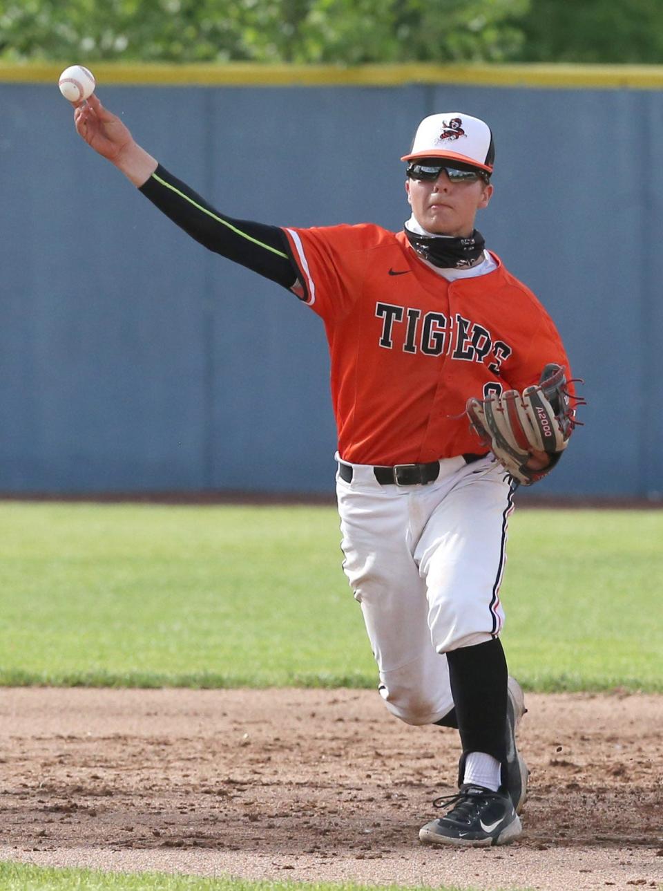 Matt McGeorge of Massillon throws to first to get Sammy Rapposelli of Mayfield during their Division I district final at Thurman Munson Stadium on Thursday, May 27, 2021.