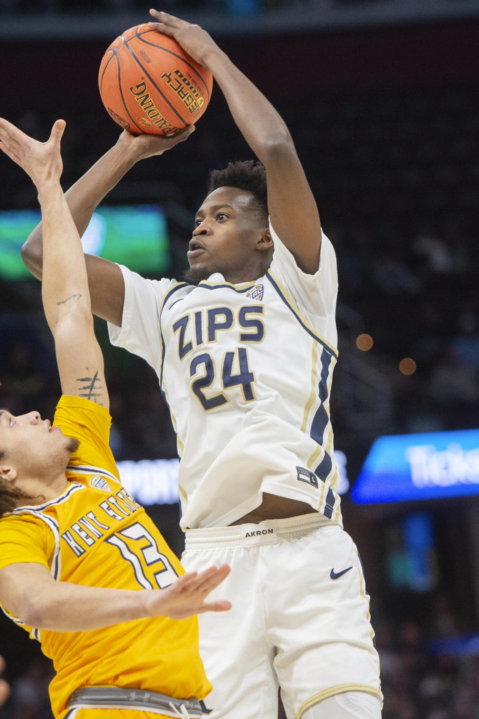 Akron's Ali Ali (24) shoots over Kent State's Jalen Sullinger (13) during the first half of an NCAA college basketball game in the championship of the Mid-American Conference tournament, Saturday, March 16, 2024, in Cleveland. (AP Photo/Phil Long)