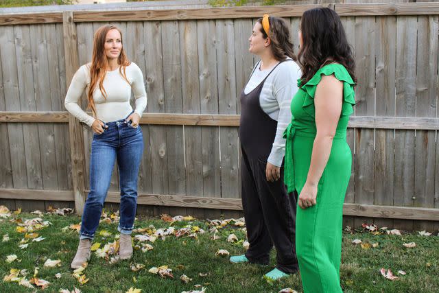 <p>HGTV</p> Mina Starsiak Hawk (left) helps artist Siena, accompanied by her friend Sylva (far right) find a home.