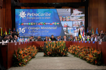 Venezuela's President Nicolas Maduro (C) speaks during the 16th PetroCaribe Ministerial Council in Caracas May 27, 2016. Miraflores Palace/Handout via REUTERS