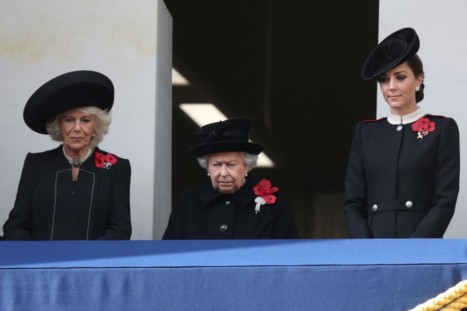 The Queen, Camilla and Duchess of Cambridge watch the Cenotaph service from the balcony at the Foreign Office (PA)