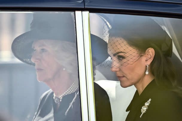 PHOTO: Britain's Camilla, Queen Consort and Britain's Catherine, Princess of Wales are driven behind the coffin of Queen Elizabeth II, during a procession from Buckingham Palace to the Palace of Westminster, in London, Sept. 14, 2022. (Marco Bertorello/AFP via Getty Images)