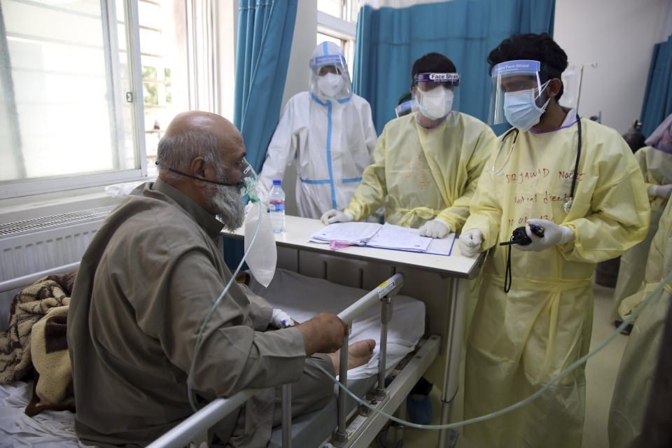 A patient is connected to an oxygen tank in the Intensive Care Unit ward for COVID-19 patients at the Afghan-Japan Communicable Disease Hospital in Kabul, Afghanistan, Tuesday June 30, 2020. (AP Photo/Rahmat Gul)