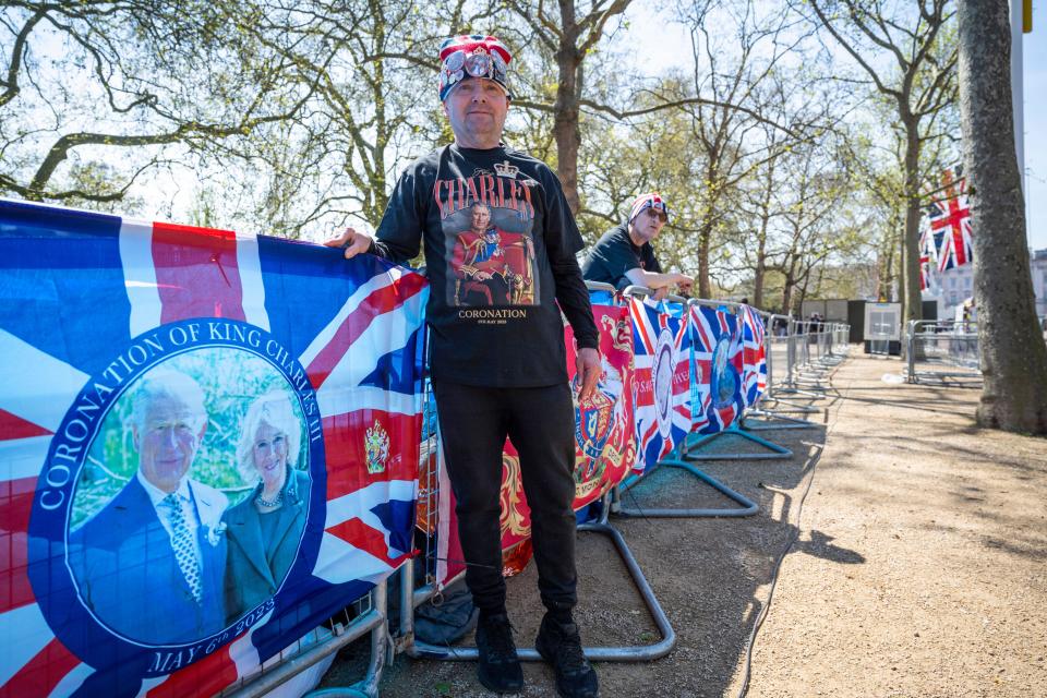 London, UK.  29 April 2023.  Royal superfan John Loughrey, 68, from Streatham, in place on The Mall ahead of the coronation of King Charles III on 6 May.  He will be camping out for the next week, sleeping on a campbed, joined by up to 10 others, with a giant sheet of blue tarpaulin as their protection against the elements until the big day. Credit: Stephen Chung / Alamy Live News