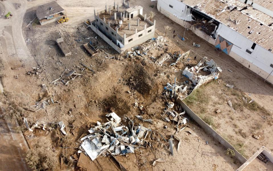 A picture taken with a drone shows the site of an Israeli air strike amid a flare-up of Israeli-Palestinian violence, in Gaza City