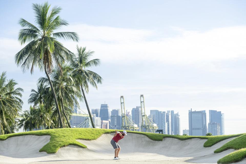 Captain Jon Rahm, of Legion XIII GC, hits his shot from the fifth bunker during the final round of LIV Golf Singapore at Sentosa Golf Club on Sunday, May 5, 2024 in Sentosa, Singapore. (Charles Laberge/LIV Golf via AP)