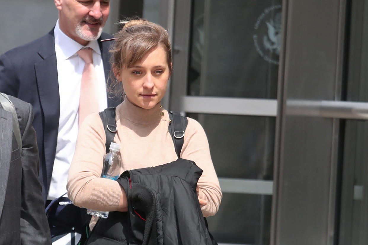 Actress Allison Mack leaves Brooklyn Federal Courthouse after facing charges regarding sex trafficking and racketeering related to the Nxivm cult case. 