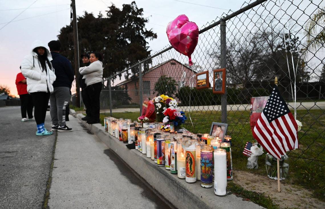 A memorial for slain Selma officer Gonzalo Carrasco Jr. is seen along the 2600 black of Pine Street Thursday evening, Feb 2, 2023 before a vigil is held at Lincoln Park in Selma.