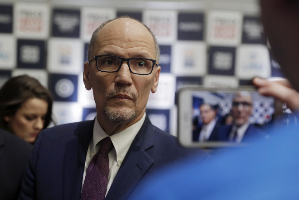 Democratic National Committee chairman Tom Perez is recorded on a phone before a Democratic presidential primary debate Thursday, Dec. 19, 2019, in Los Angeles, Calif. (AP Photo/Chris Carlson)