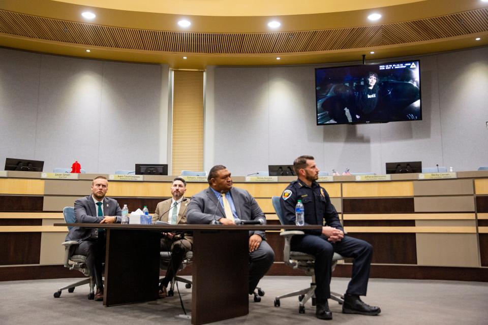 The LCPD Command Staff and Las Cruces City Manager Ifo Pili watch the body camera footage of Teresa Gomez', pictured on the television, death during a news conference about a officer-involved shooting on Tuesday, Oct. 17, 2023, at Las Cruces City Hall.