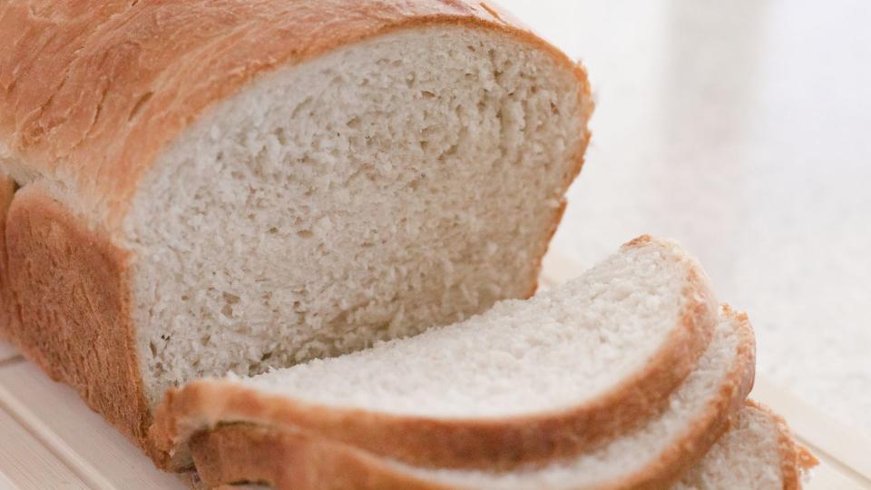 A slice of bread shown as a best cleaning hack to pick up glass shards