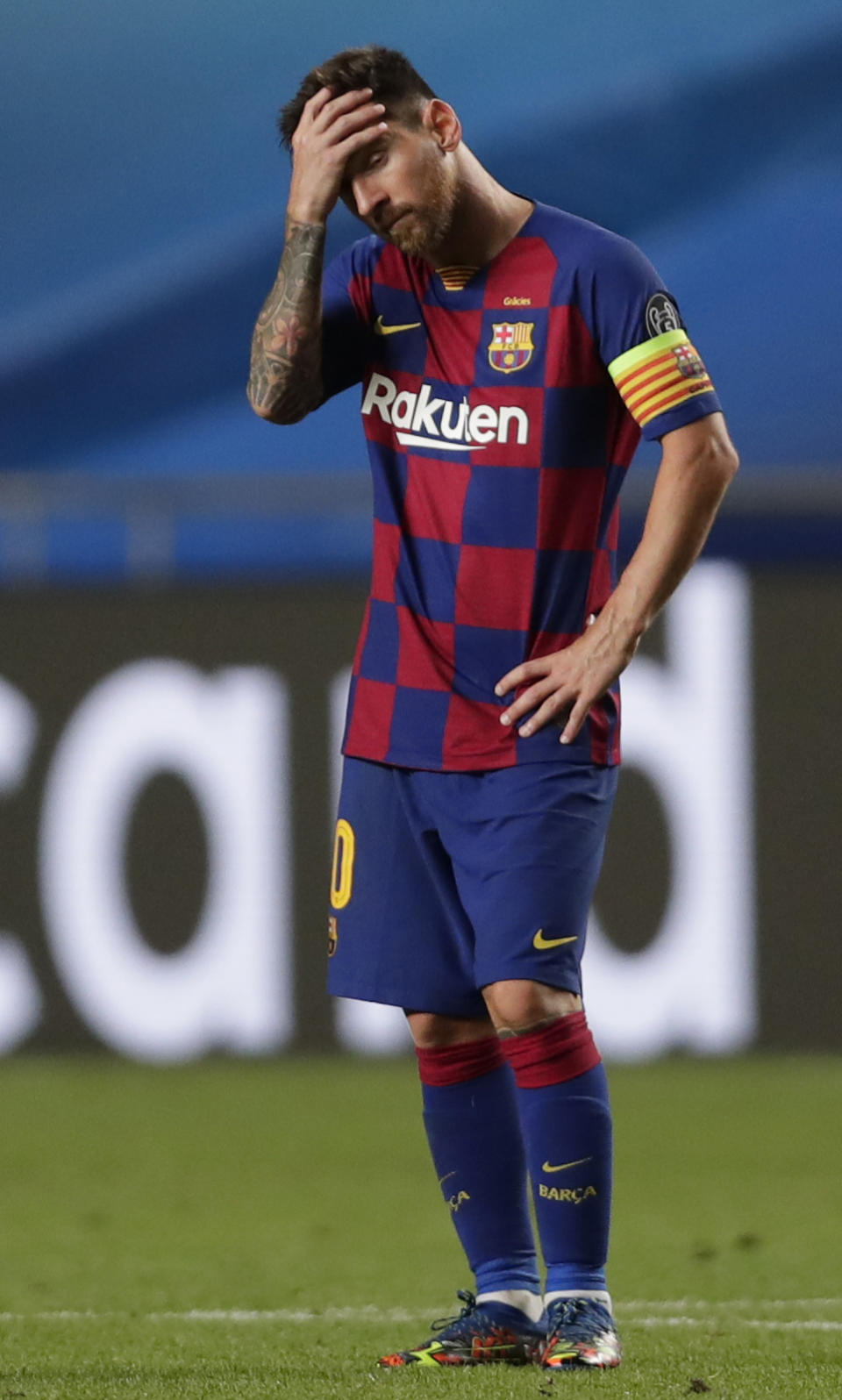 Barcelona's Lionel Messi holds his head during the Champions League quarterfinal match between FC Barcelona and Bayern Munich at the Luz stadium in Lisbon, Portugal, Friday, Aug. 14, 2020. (AP Photo/Manu Fernandez/Pool)