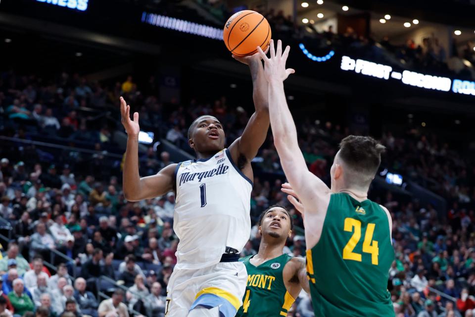 Kam Jones scored 18 straight points for Marquette in the second half against Vermont on Friday.