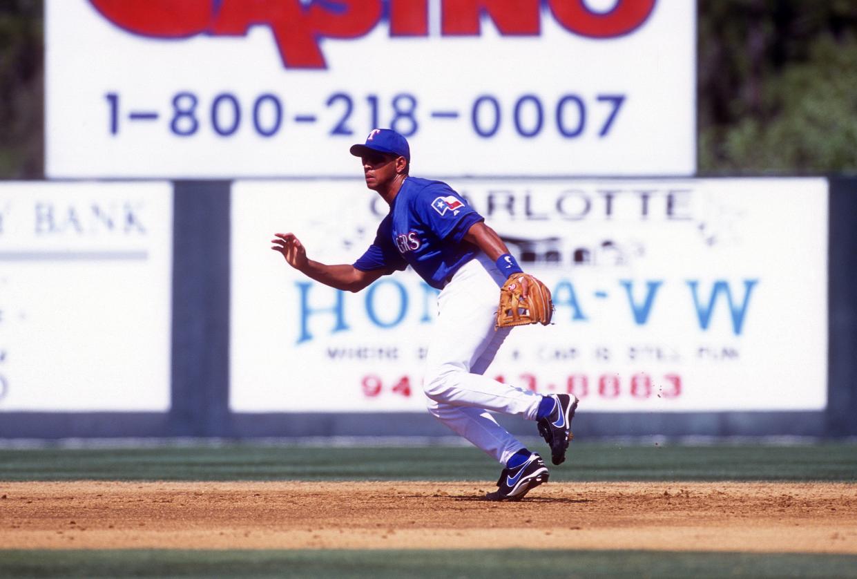 Alex Rodriguez #3 of the Texas Rangers reacts to the ball during an Major League Baseball spring training game circa 2001 at Pompano Beach Municipal Stadium in Pompano Beach, Florida.