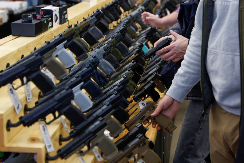 Customers shop at the Des Moines Fairgrounds Gun Show at the Iowa State Fairgrounds in Des Moines, Iowa