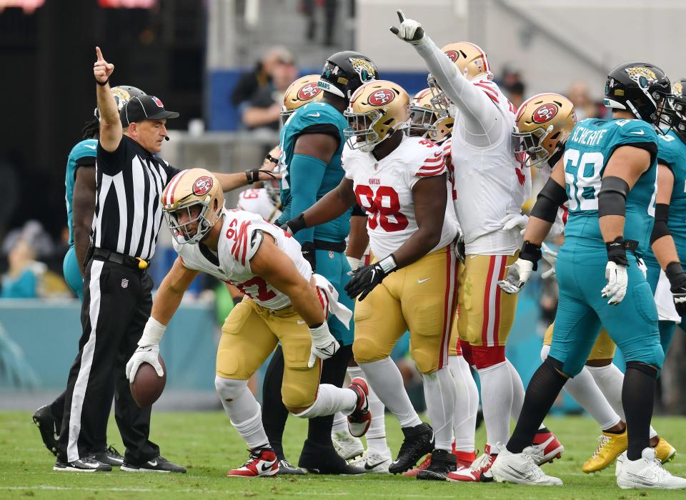 San Francisco 49ers defensive end Nick Bosa (97) comes out of the pile with the ball after Jacksonville Jaguars quarterback Trevor Lawrence (16) fumbled on a sack during early second quarter action. The Jacksonville Jaguars hosted the San Francisco 49ers at EverBank Stadium in Jacksonville, FL Sunday, November 12, 2023. The Jaguars trailed 13 to 3 at the half. [Bob Self/Florida Times-Union]