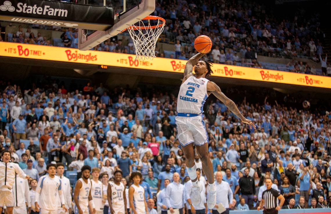 North Carolina’s Caleb Love (2) goes to the basket for a dunk to give the Tar Heels a 102-84 lead against College of Charleston in the final seconds of play on Friday, November 11, 2022 at the Smith Center in Chapel Hill, N.C.