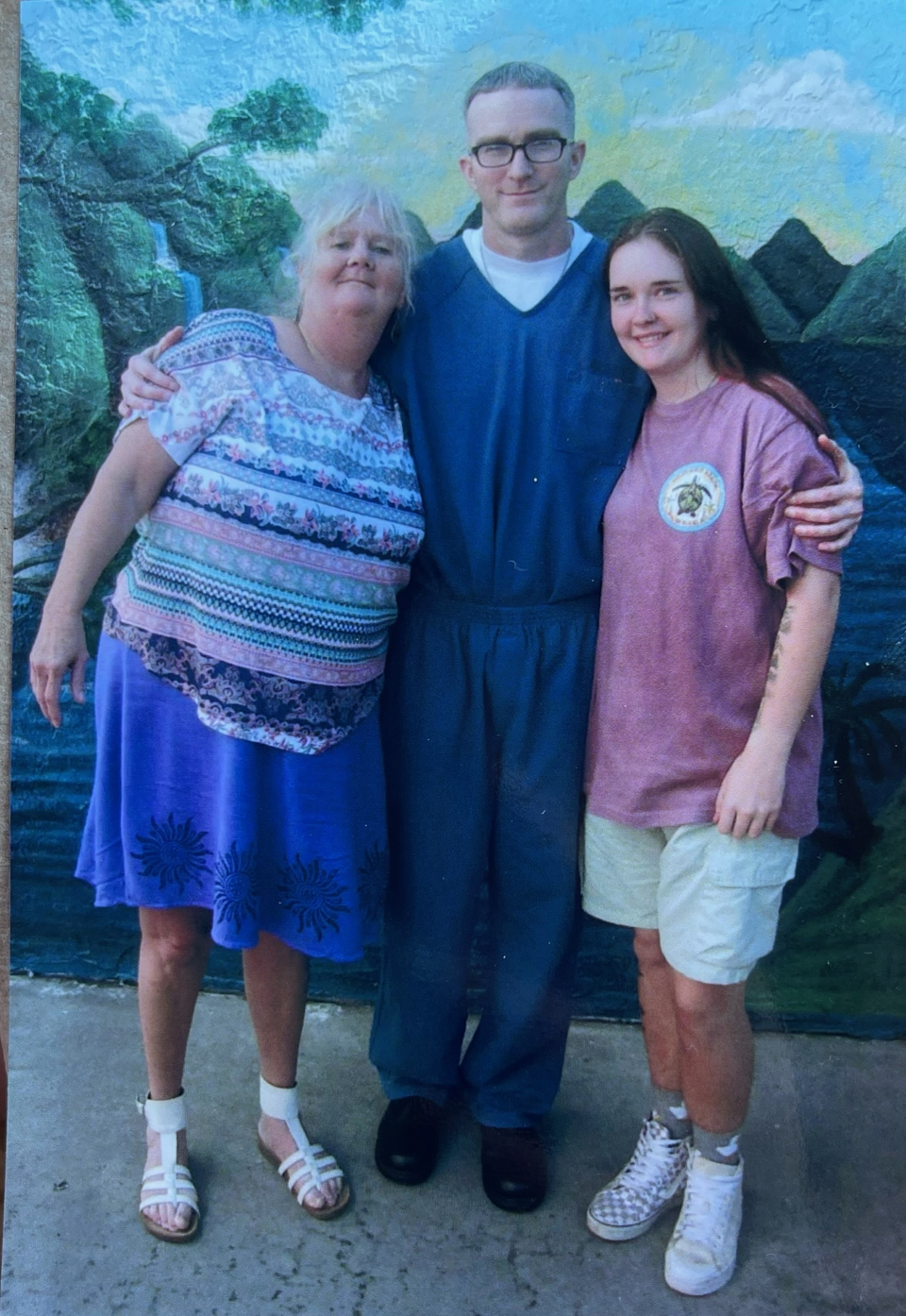 Jabe Carney stands with his mom and niece at the prison's visitor center in January 2023.
