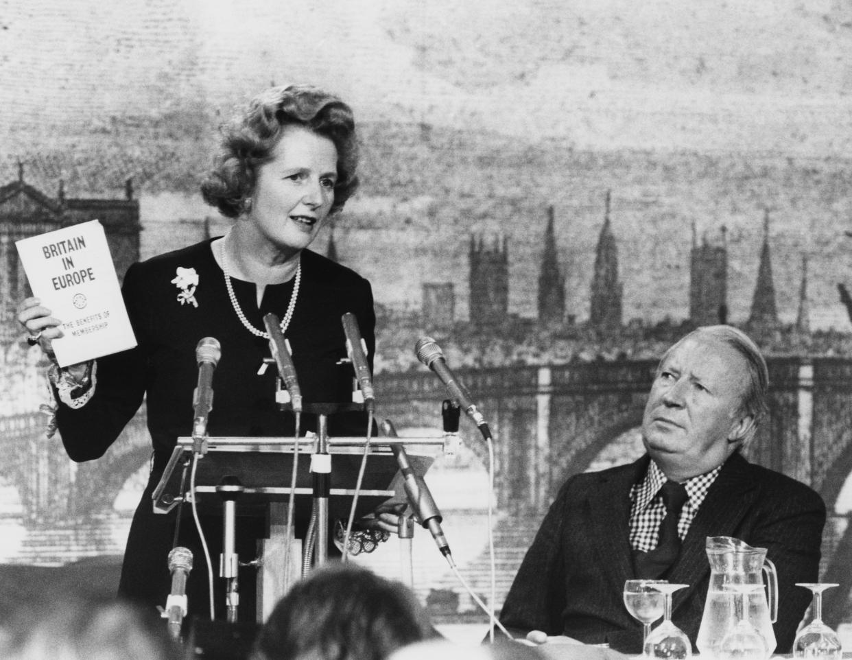 Margaret Thatcher speaks during the Conservative Party’s campaign to keep Britain in the Common Market, watched by her predecessor, Edward Heath, on May 17, 1975. (Photo: Central Press/Hulton Archive/Getty Images)