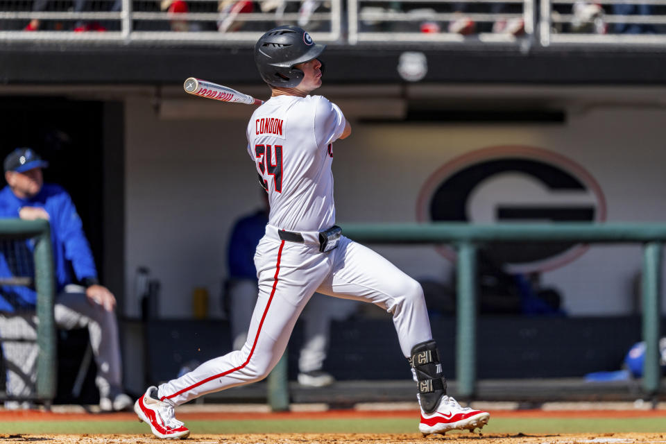 FILE - Georgia outfielder Charlie Condon (24) watches his hit during an NCAA college baseball game Sunday, Feb. 18, 2024, in Athens, Ga. The field for the NCAA baseball tournament will take shape this week with conference tournaments determining most of the 30 automatic qualifiers. (AP Photo/Jason Allen, File)