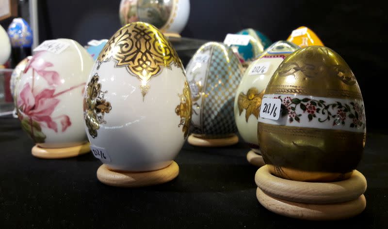Russian imperial porcelaine eggs are seen during an auction preview at Piguet Auction House in Geneva