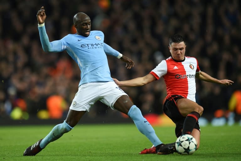 Manchester City's defender Eliaquim Mangala (L) tackles Feyenoord's striker Steven Berghuis (R) during the UEFA Champions League Group F football match November 21, 2017