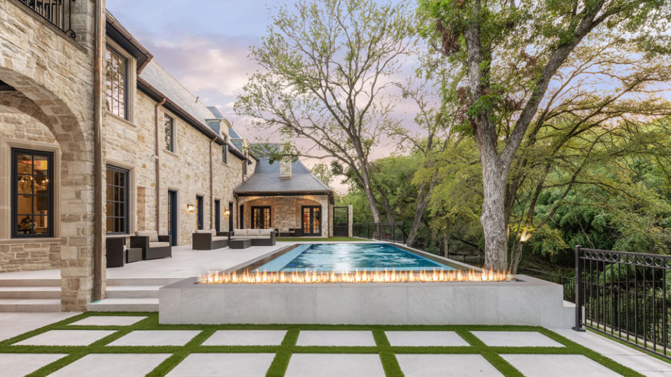 The pool is accompanied by a fire feature. - Credit: Sotheby's Concierge Auctions