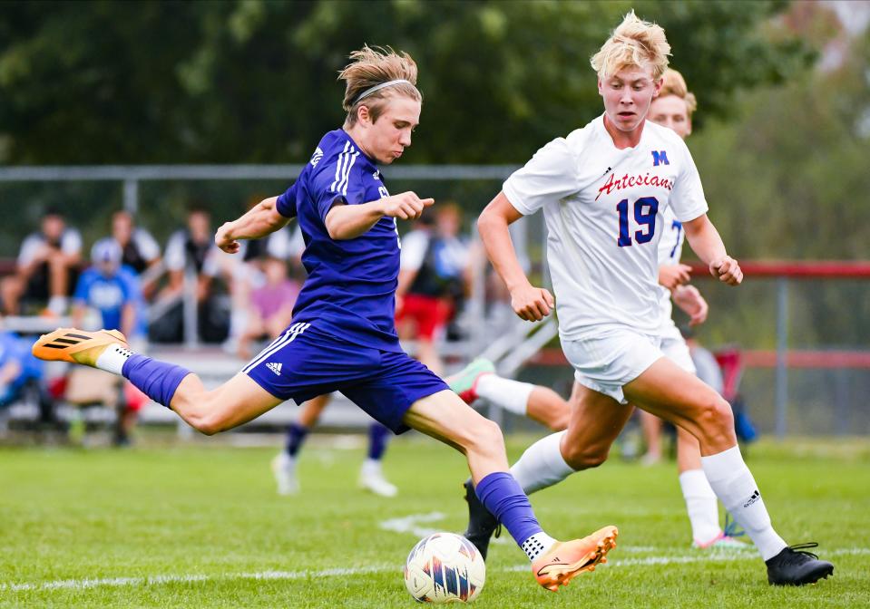 Bloomington South’s Etienne Leykin (9) attempts a shot past Martinsville’s Will Payton (19) during the IHSAA Boys’ soccer sectional match at Terre Haute South on Wednesday, Oct. 4, 2023.