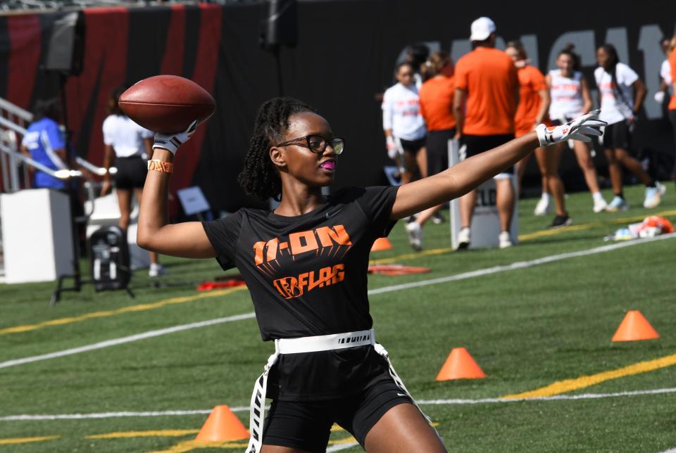 Saryah Cannon, a freshman at Seton, eyes an open receiver downfield at the girls' flag football kickoff jamboree sponsored by USA Football and the Cincinnati Bengals at Paycor Stadium, Sept. 30, 2023.
