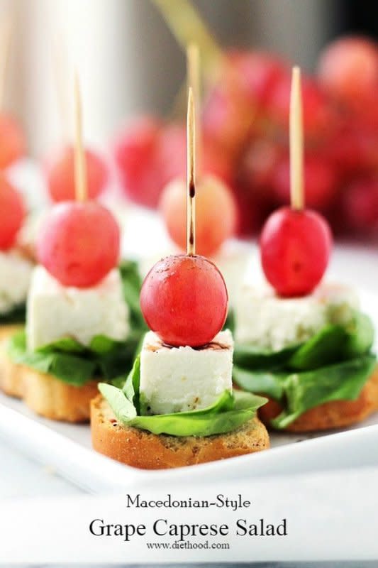 <p>Diethood</p><p>This light, fresh appetizer-salad is made with red grapes, feta and spinach, set atop slices of garlic toast.</p><p><strong>Get the recipe: <a href="https://diethood.com/macedonian-style-grape-caprese-salad/" rel="nofollow noopener" target="_blank" data-ylk="slk:Macedonian Style Grape Caprese Salad;elm:context_link;itc:0;sec:content-canvas" class="link ">Macedonian Style Grape Caprese Salad</a></strong></p>