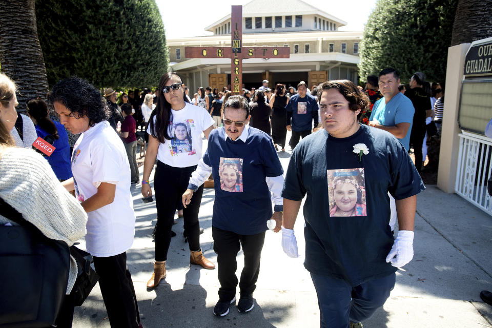 Mourners leave a funeral for Keyla Salazar, 13, on Tuesday, Aug. 6, 2019, in San Jose, Calif. Salazar and two others were killed when a gunman opened fire at the Gilroy Garlic Festival July 28. (AP Photo/Noah Berger)