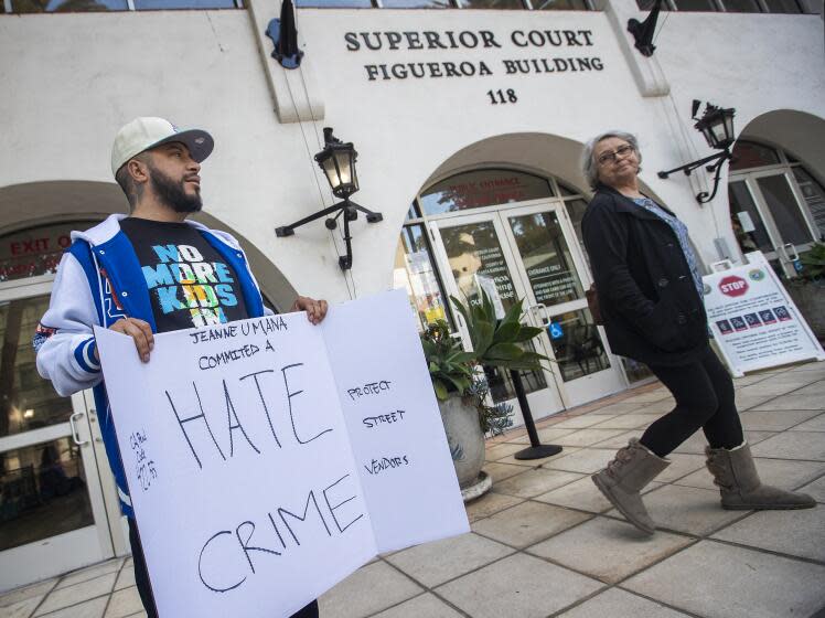 SANTA BARBARA, CA-NOVEMBER 30, 2023:Activist Edin Alex Enamorado, protests outside of Santa Barbara Superior Court during the arraignment for Jeanne Umana, a woman caught on two separate videos, using racist language to Latino men. Enamorado wants her to be charged with a hate crime. Her arraignment was continued until January 3, 2024. (Mel Melcon / Los Angeles Times)