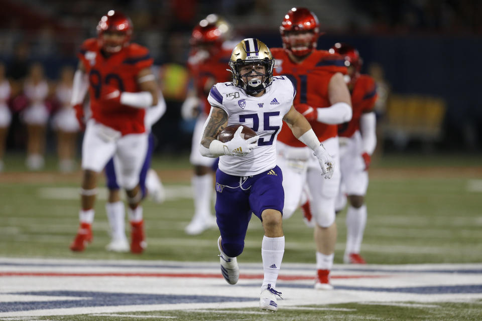 Washington running back Sean McGrew (25) runs for a first down against Arizona during the first half of an NCAA college football game Saturday, Oct. 12, 2019, in Tucson, Ariz. (AP Photo/Rick Scuteri)