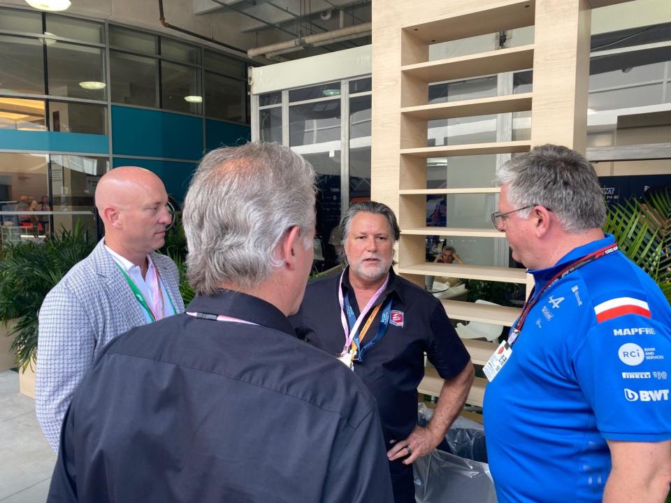 (From left) Group 1001 CEO Dan Towriss, Andretti Autosport executive vice president and COO J.F. Thormann, Michael Andretti and Alpine F1 team principal Otmar Szafnauer talk Friday in the Miami Grand Prix paddock Friday afternoon - one of several encounters with F1 power players Andretti was seen to have had as he waits on the FIA and FOM to announce a decision on the new F1 team he'd like to build.