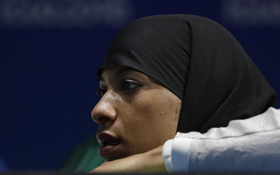 Ibtihaj Muhammad of the United States watches her teammates compete with Russia in a women's team sabre fencing semifinal at the 2016 Summer Olympics in Rio de Janeiro, Brazil, Saturday, Aug. 13, 2016. (AP Photo/Andrew Medichini)